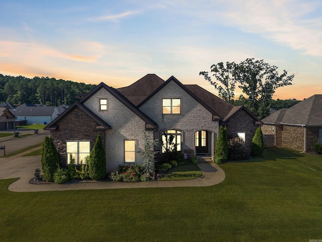 2705 Pulaski Dr, Conway, AR 72034 - french country inspired facade with a front lawn and brick siding