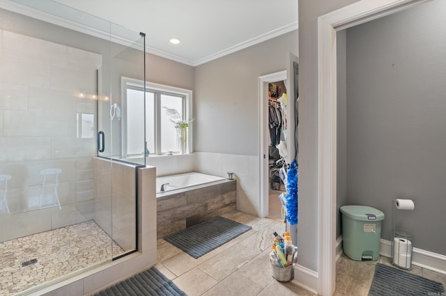 2705 Pulaski Dr, Conway, AR 72034 - bathroom with a shower stall, a garden tub, ornamental molding, a walk in closet, and tile patterned floors
