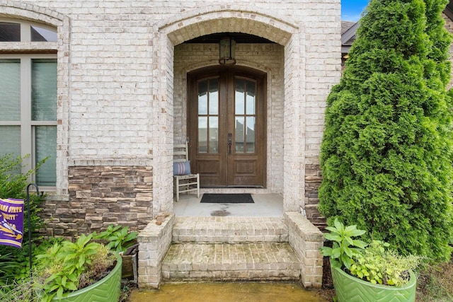 2705 Pulaski Dr, Conway, AR 72034 - entrance to property featuring brick siding, french doors, and stone siding
