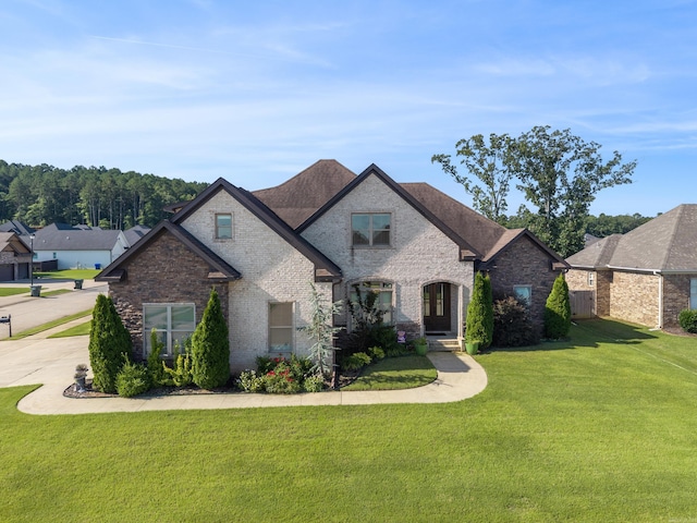2705 Pulaski Dr, Conway, AR 72034 - french country inspired facade with a front yard and brick siding