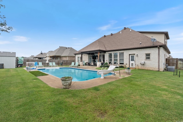 2705 Pulaski Dr, Conway, AR 72034 - view of swimming pool featuring a water slide, a patio area, and a fenced backyard