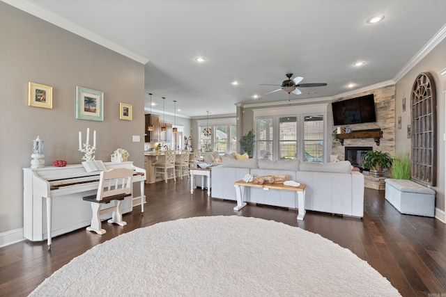 2705 Pulaski Dr, Conway, AR 72034 - living area featuring ornamental molding, recessed lighting, dark wood finished floors, a ceiling fan, and a stone fireplace