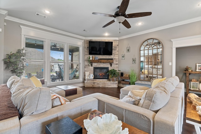 2705 Pulaski Dr, Conway, AR 72034 - living room featuring ceiling fan, plenty of natural light, ornamental molding, wood finished floors, and a fireplace