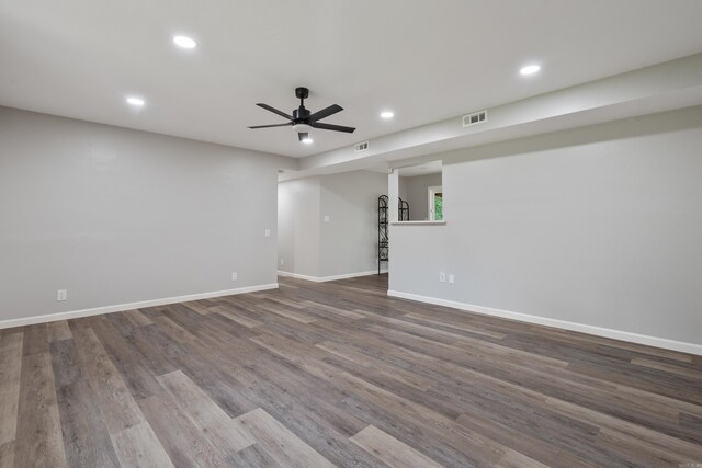 unfurnished room featuring recessed lighting, a ceiling fan, and dark wood-type flooring