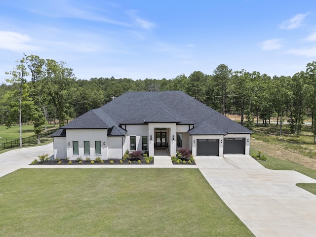 2960 Orchard View Dr, Conway, AR 72034 - view of front of house with a front lawn, driveway, french doors, and a garage