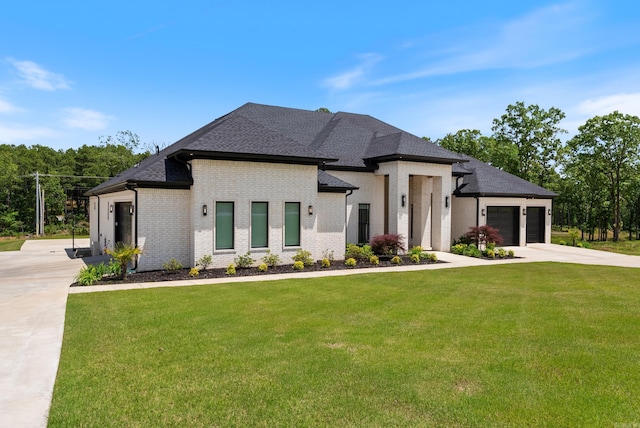 2960 Orchard View Dr, Conway, AR 72034 - view of front of home featuring an attached garage, a front yard, driveway, brick siding, and a shingled roof