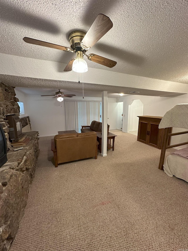 900 Davidson Cir, Edgemont, AR 72044 - living area with carpet, a textured ceiling, a ceiling fan, and arched walkways