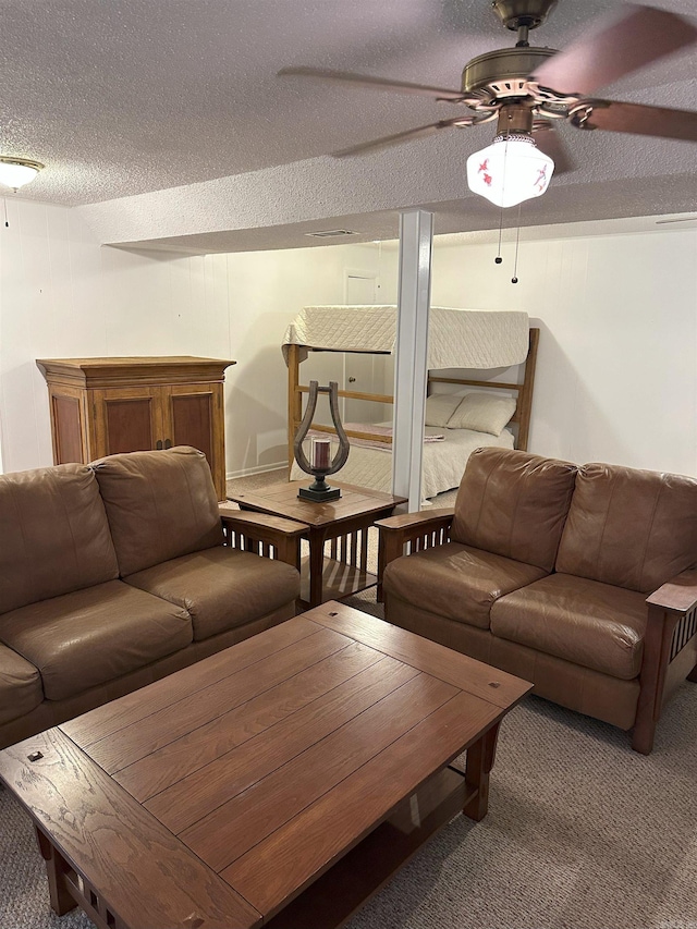 900 Davidson Cir, Edgemont, AR 72044 - carpeted living room featuring a ceiling fan, a textured ceiling, and bar area