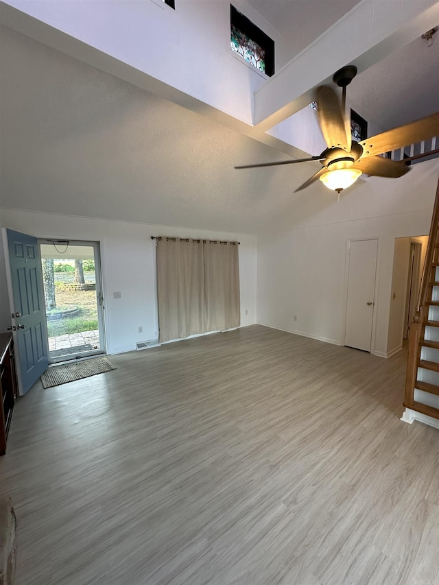 900 Davidson Cir, Edgemont, AR 72044 - unfurnished living room featuring stairs, light wood-style flooring, and a ceiling fan