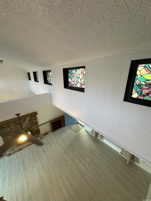 900 Davidson Cir, Edgemont, AR 72044 - unfurnished bedroom with wood finished floors and a textured ceiling