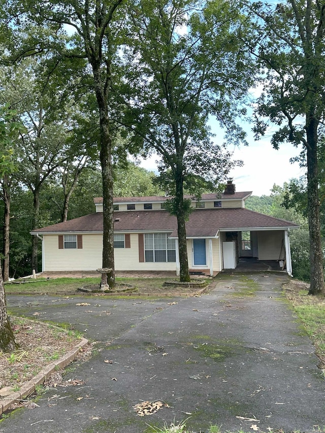 900 Davidson Cir, Edgemont, AR 72044 - view of front of home with driveway, a carport, and a chimney