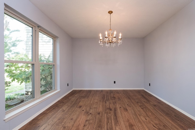 1905 Broken Bow, North Little Rock, AR 72116 - spare room with healthy amount of natural light, dark wood-style flooring, and a chandelier