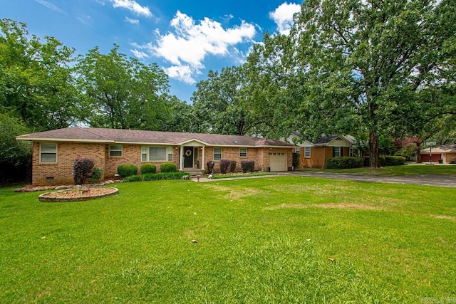 7111 W Markham St, Little Rock, AR 72205 - single story home featuring driveway, brick siding, a front lawn, and an attached garage