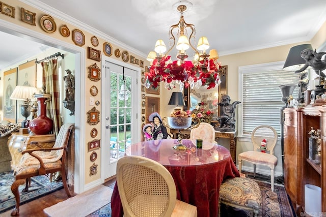 7111 W Markham St, Little Rock, AR 72205 - dining area featuring a chandelier, crown molding, and wood finished floors