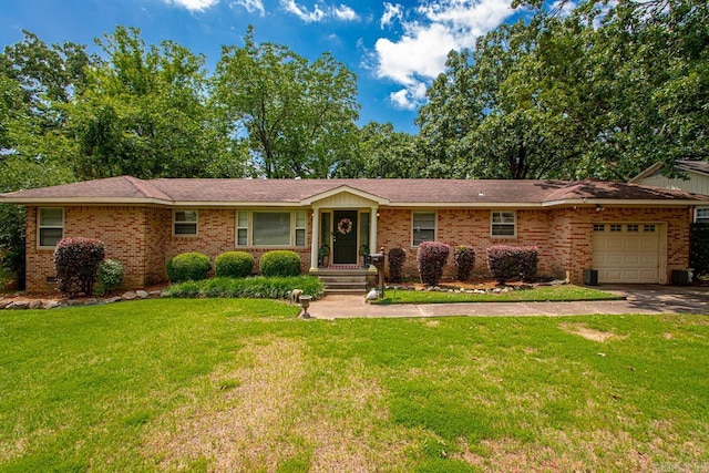 7111 W Markham St, Little Rock, AR 72205 - ranch-style house with a garage, a front yard, brick siding, and concrete driveway