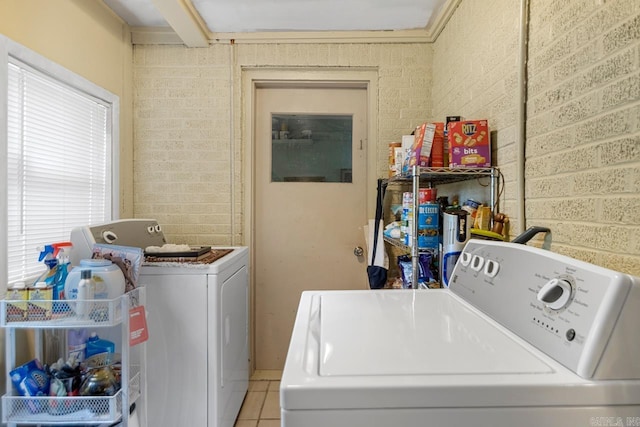 7111 W Markham St, Little Rock, AR 72205 - washroom with washer and dryer and light tile patterned flooring