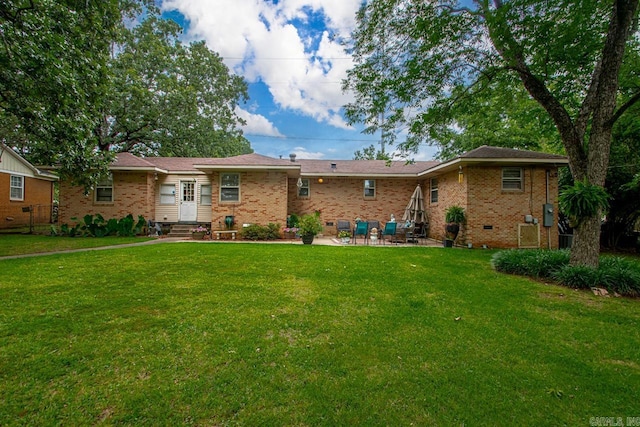 7111 W Markham St, Little Rock, AR 72205 - view of front facade with a front lawn, brick siding, a patio, and entry steps
