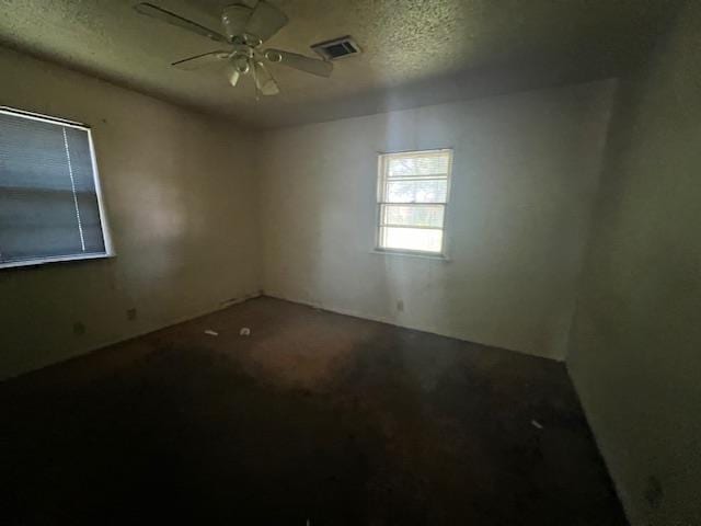 1508 N Easy, Jonesboro, AR 72401 - unfurnished room featuring a textured ceiling and ceiling fan