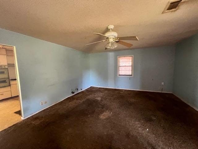 1508 N Easy, Jonesboro, AR 72401 - unfurnished room with ceiling fan, carpet flooring, and a textured ceiling