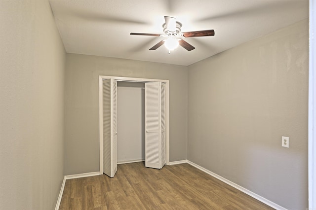 6905 White Oak Cv, White Hall, AR 71602 - unfurnished bedroom with dark wood finished floors, a closet, and ceiling fan