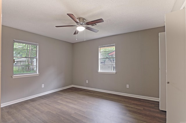 6905 White Oak Cv, White Hall, AR 71602 - empty room featuring dark wood finished floors, a textured ceiling, and ceiling fan