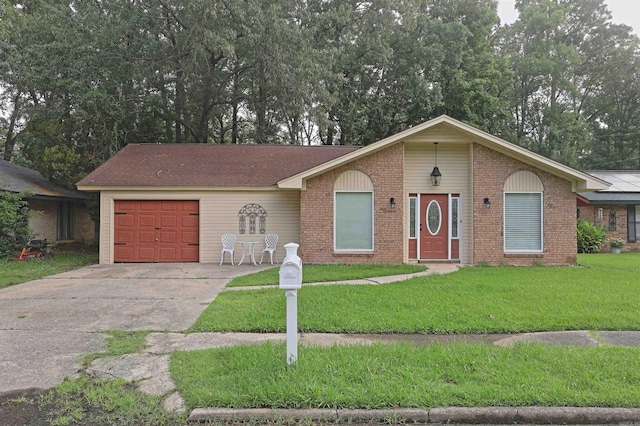 6905 White Oak Cv, White Hall, AR 71602 - single story home with a garage, a front yard, brick siding, and concrete driveway