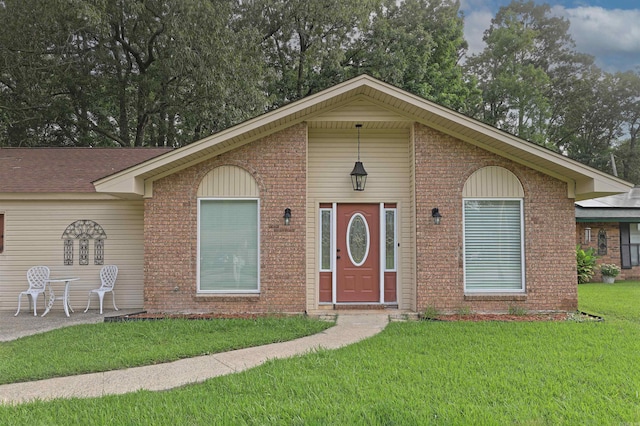 6905 White Oak Cv, White Hall, AR 71602 - ranch-style house with a front lawn and brick siding
