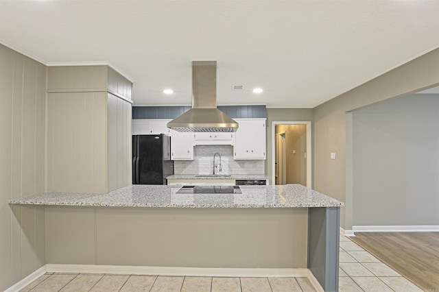 6905 White Oak Cv, White Hall, AR 71602 - kitchen featuring black appliances, island range hood, a peninsula, light stone counters, and recessed lighting