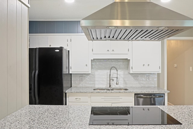 6905 White Oak Cv, White Hall, AR 71602 - kitchen with wall chimney range hood, black appliances, white cabinetry, tasteful backsplash, and light stone countertops