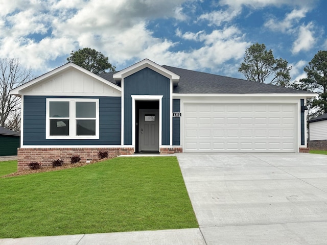 3713 Wise Rd, Bryant, AR 72002 - view of front of property with concrete driveway, brick siding, a front yard, an attached garage, and board and batten siding