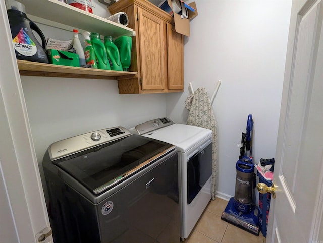 532 Scenic Valley Dr, Heber Springs, AR 72543 - laundry room with independent washer and dryer, cabinet space, and light tile patterned flooring