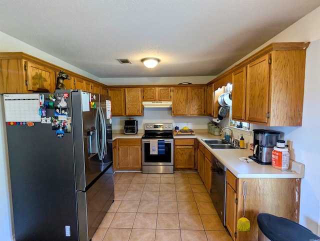 532 Scenic Valley Dr, Heber Springs, AR 72543 - kitchen with refrigerator with ice dispenser, stainless steel electric stove, under cabinet range hood, brown cabinetry, and light countertops