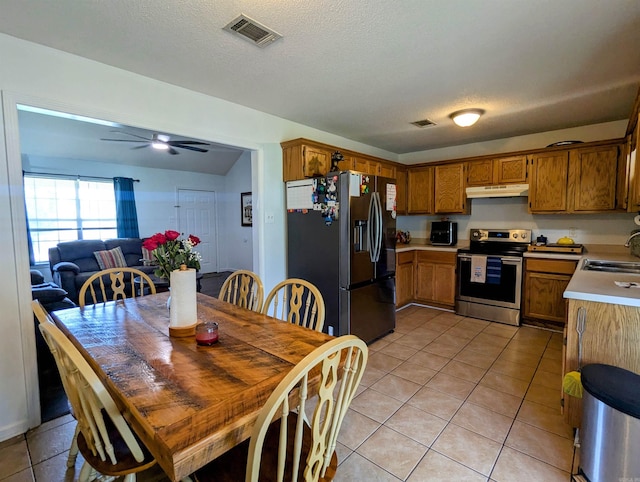 532 Scenic Valley Dr, Heber Springs, AR 72543 - kitchen with refrigerator with ice dispenser, electric stove, light tile patterned flooring, light countertops, and brown cabinets