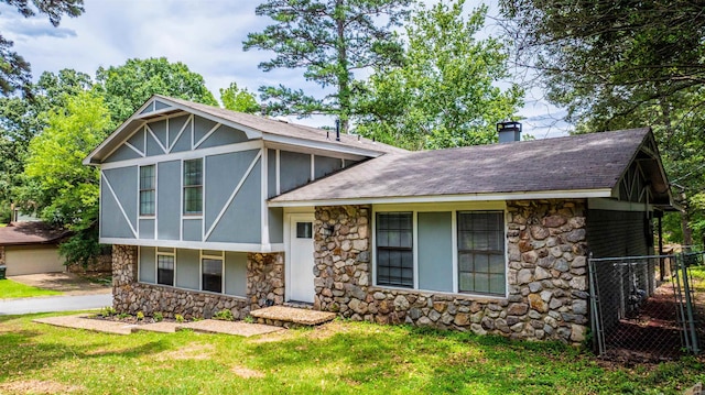 4901 Westwood Ave, Little Rock, AR 72204 - view of front of house with stone siding, a chimney, roof with shingles, and stucco siding