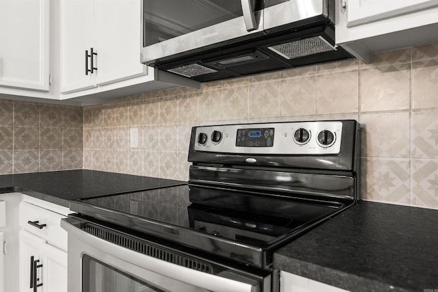 4901 Westwood Ave, Little Rock, AR 72204 - kitchen with appliances with stainless steel finishes, white cabinetry, dark countertops, and decorative backsplash