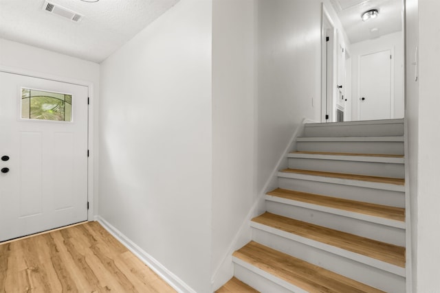 4901 Westwood Ave, Little Rock, AR 72204 - entryway featuring wood finished floors and a textured ceiling