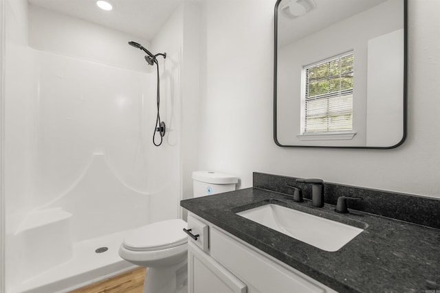 4901 Westwood Ave, Little Rock, AR 72204 - bathroom featuring vanity, a shower, and wood finished floors