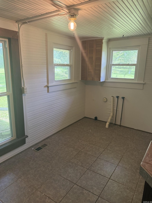 408 Case St, Heber Springs, AR 72543 - unfurnished room featuring healthy amount of natural light, wooden ceiling, and dark tile patterned flooring