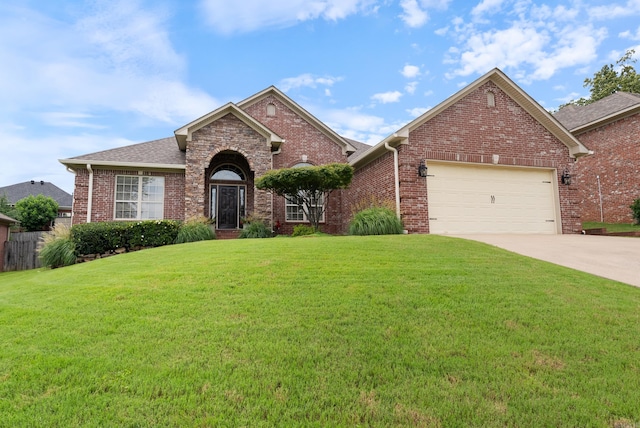 144 Summit Valley Cir, Maumelle, AR 72113 - traditional-style home featuring a front lawn, brick siding, an attached garage, concrete driveway, and roof with shingles