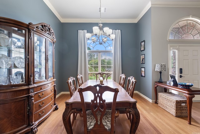 144 Summit Valley Cir, Maumelle, AR 72113 - dining space featuring a chandelier, light wood-style flooring, and crown molding