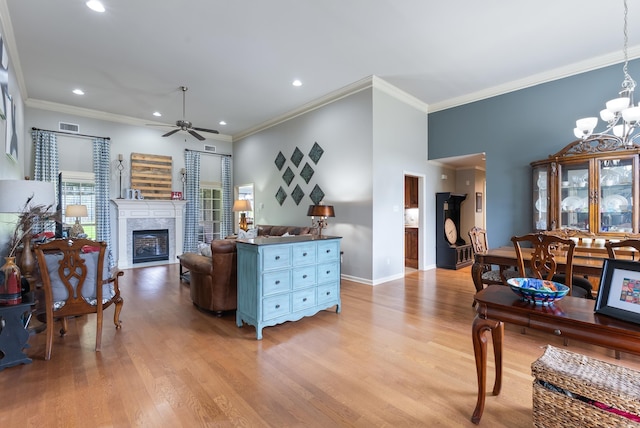 144 Summit Valley Cir, Maumelle, AR 72113 - living room featuring a ceiling fan, a fireplace, ornamental molding, recessed lighting, and light wood-style flooring