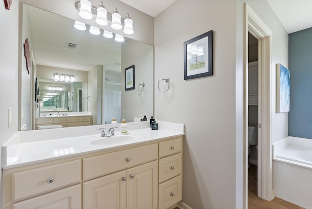 144 Summit Valley Cir, Maumelle, AR 72113 - full bathroom featuring a garden tub, tile patterned flooring, and vanity
