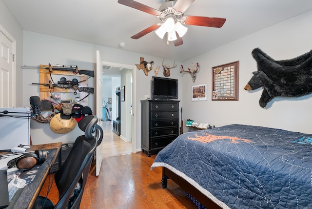144 Summit Valley Cir, Maumelle, AR 72113 - bedroom featuring wood finished floors and ceiling fan
