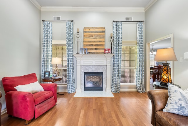 144 Summit Valley Cir, Maumelle, AR 72113 - living room with wood finished floors, a fireplace with flush hearth, healthy amount of natural light, and crown molding