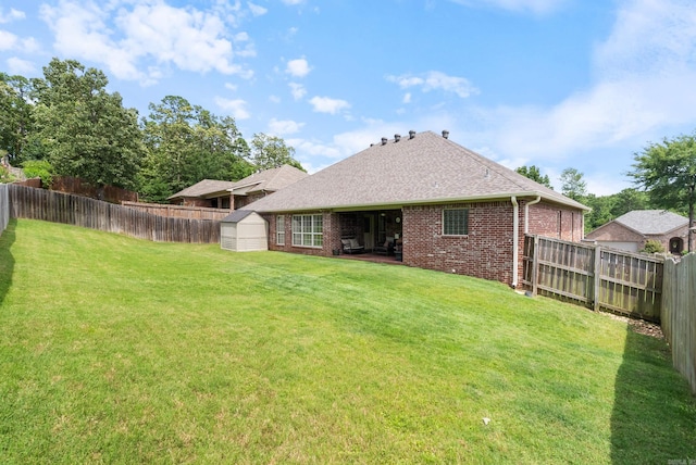 144 Summit Valley Cir, Maumelle, AR 72113 - back of property featuring a shed, brick siding, a fenced backyard, and roof with shingles