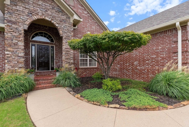 144 Summit Valley Cir, Maumelle, AR 72113 - entrance to property featuring brick siding, stone siding, and roof with shingles