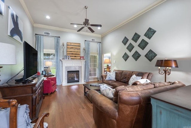 144 Summit Valley Cir, Maumelle, AR 72113 - living room with a ceiling fan, crown molding, recessed lighting, wood finished floors, and a premium fireplace