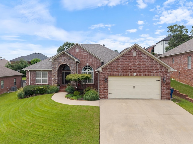 144 Summit Valley Cir, Maumelle, AR 72113 - traditional-style house featuring brick siding, an attached garage, and a front lawn