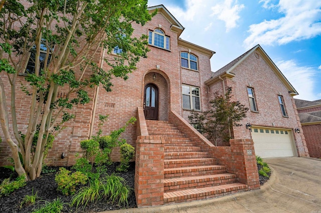 22 Jacob Pl, Little Rock, AR 72211 - traditional-style home featuring a garage, concrete driveway, and brick siding
