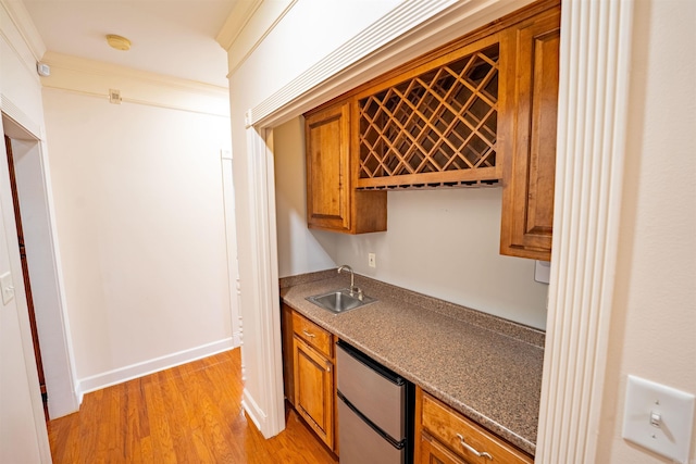 22 Jacob Pl, Little Rock, AR 72211 - kitchen with brown cabinets, light wood-style flooring, and refrigerator